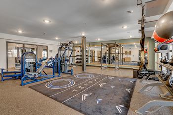 the gym at the enclave at woodbridge apartments in sugar land, tx